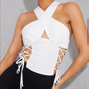 White woven sleeveless lace up side long top.
